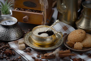 Coffee in a cup and saucer on an old background.