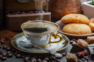 Black coffee on an old background in a cup