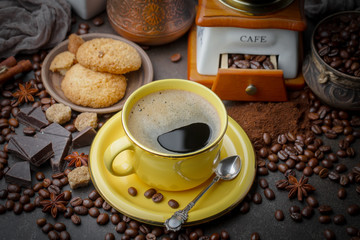 Coffee beans are roasted in a pan with smoke.