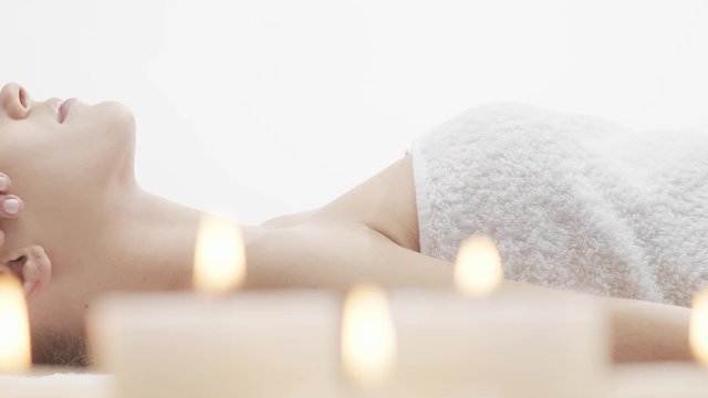 Young, beautiful and healthy woman in spa salon. Traditional Thai massage therapy and skin care.