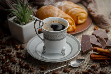 Black coffee on an old background in a cup
