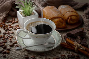 Black coffee on an old background in a cup