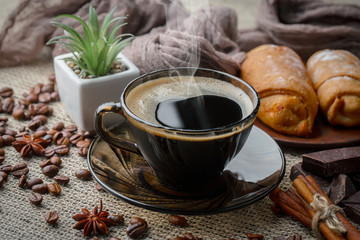 Coffee in a cup and saucer on an old background.