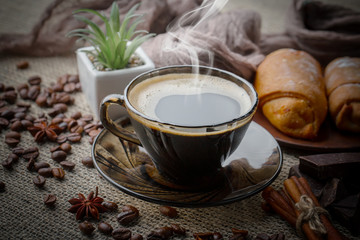 Black coffee on an old background in a cup