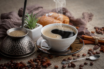 Black coffee on an old background in a cup