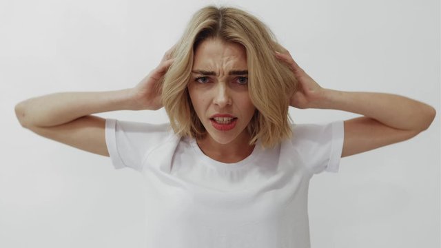 girl scream a white t-shirt on a white background. people emotions
