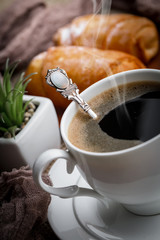 Black coffee on an old background in a cup