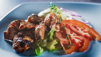 fried chicken breast piece fillet with vegetables salad on white plate