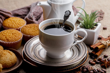 Black coffee on an old background in a cup