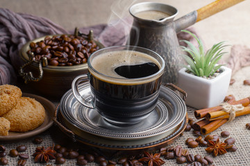 Black coffee on an old background in a cup