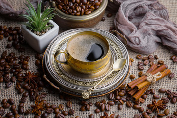 Black coffee on an old background in a cup