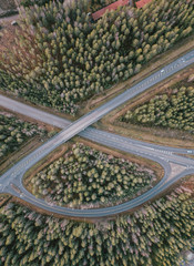 beautiful Aerial view of highway and overpass with green woods in Finland near Helsinki