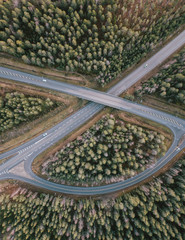 beautiful Aerial view of highway and overpass with green woods in Finland near Helsinki