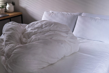 quilt bed white pillows on white bed in bedroom