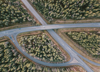 beautiful Aerial view of highway and overpass with green woods in Finland near Helsinki