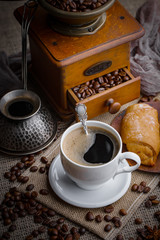 Black coffee on an old background in a cup