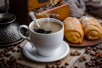 Black coffee on an old background in a cup