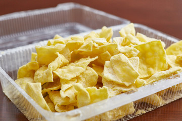 traditional turkish dish. Oriental sweets of brushwood lie in a plastic container. Close-up
