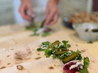 Women cooks shawarma