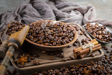 Coffee grains on a table with accessories for coffee
