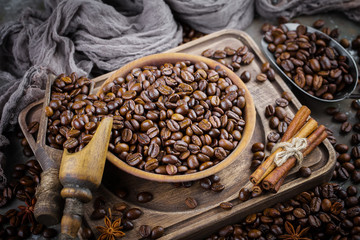 Coffee grains on a table with accessories for coffee