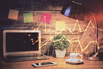 Multi exposure of graph and financial info and work space with computer background. Concept of...