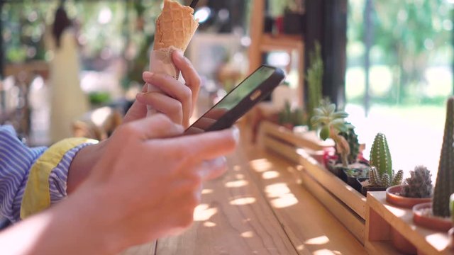 4k video People hand using smartphone with blur cafe shop background. Business, financial, trade stock maket and social network concept.