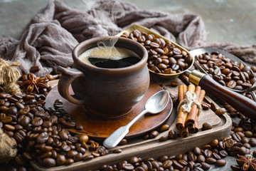 Coffee in a cup and saucer on an old background.