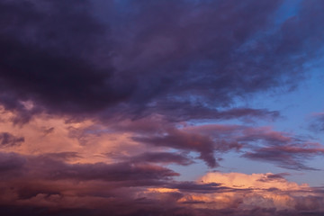Naklejka na ściany i meble Dramatic sunrise, sunset pink violet storm sky with clouds background texture