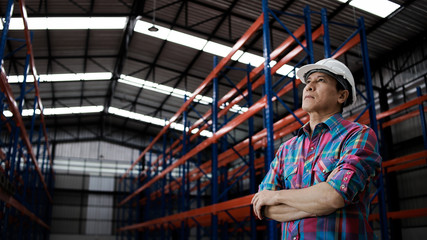 Fototapeta na wymiar Asian Engineer man working in building factory