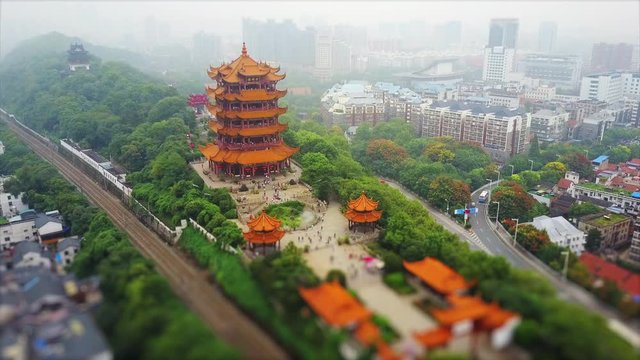 wuhan city day time famous yellow crane temple traffic road aerial panorama 4k tilt shift china