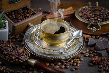 Black coffee on an old background in a cup