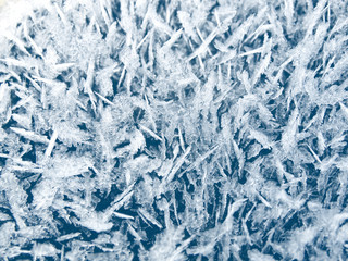 winter background with snowflakes crystals patterns and snow on frozen grass