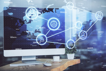 Computer on desktop with social network theme icon. Multi exposure. Concept of international connections.