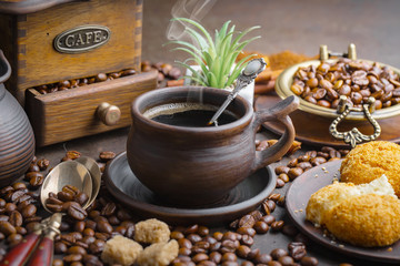 Coffee in a cup and saucer on an old background.