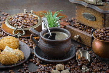Obraz na płótnie Canvas Black coffee on an old background in a cup