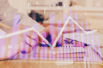 Multi exposure closeup hands with stock market forex graph.