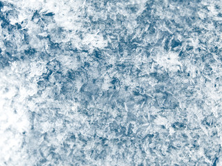 winter background with snowflakes crystals patterns and snow on frozen grass