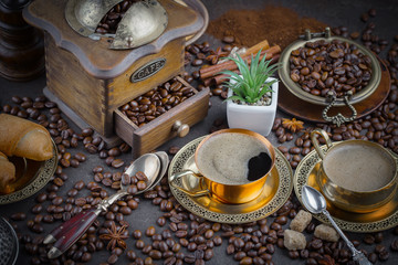 Fototapeta na wymiar Black coffee on an old background in a cup
