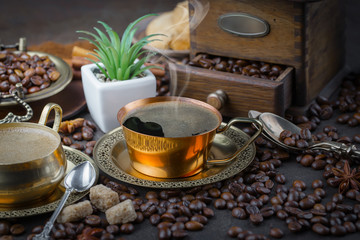 Black coffee on an old background in a cup