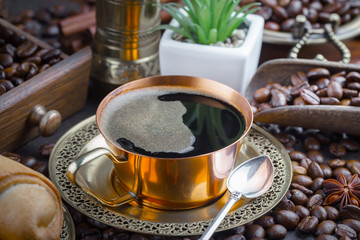 Black coffee on an old background in a cup