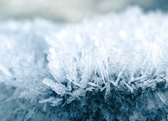 winter background with snowflakes crystals patterns and snow on frozen grass