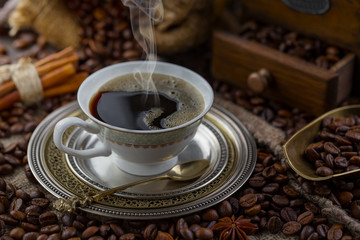 Black coffee on an old background in a cup