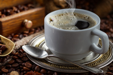 Black coffee on an old background in a cup