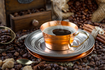 Black coffee on an old background in a cup