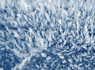 winter background with snowflakes crystals patterns and snow on frozen grass