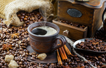Coffee in a cup and saucer on an old background.