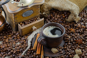 Coffee in a cup and saucer on an old background.