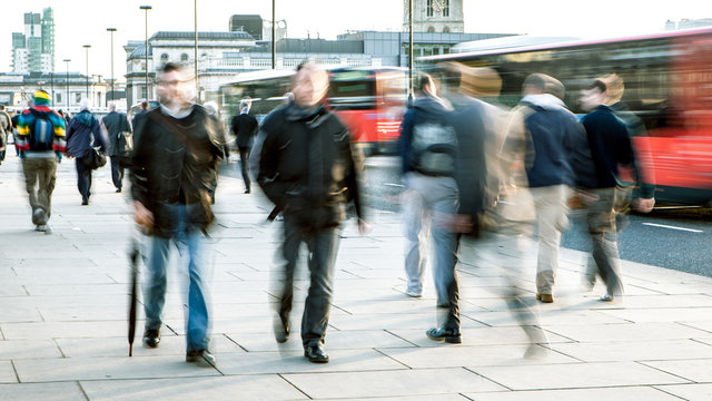 Blurred Commuters. Abstract long exposure blur of office workers and commuters on London Bridge during a cold winters day.