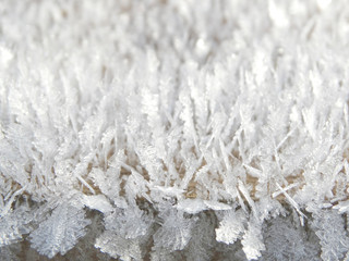 winter background with snowflakes crystals patterns and snow on frozen grass